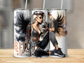 Tattooed woman with dark wings and text "Bitch Mode" on a tumbler.
