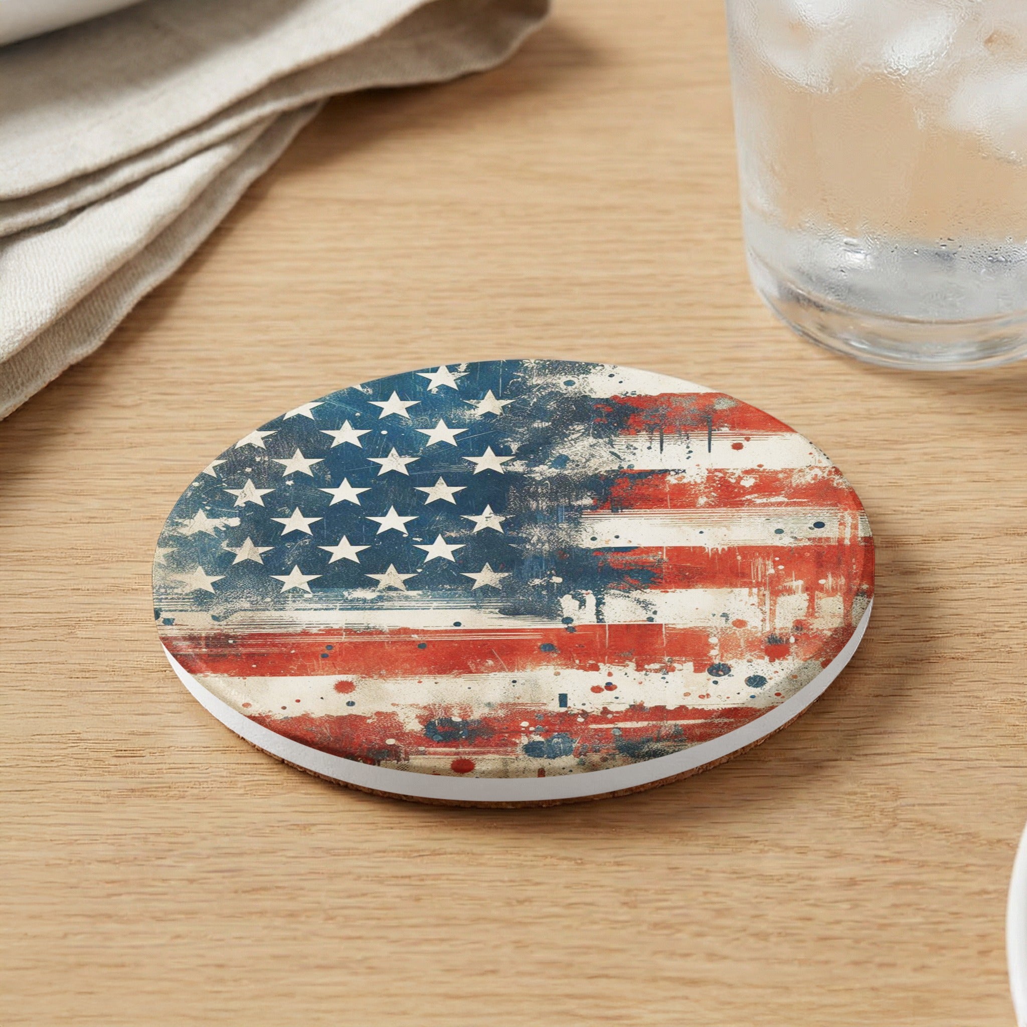 Round coaster with distressed American flag design on wooden surface.